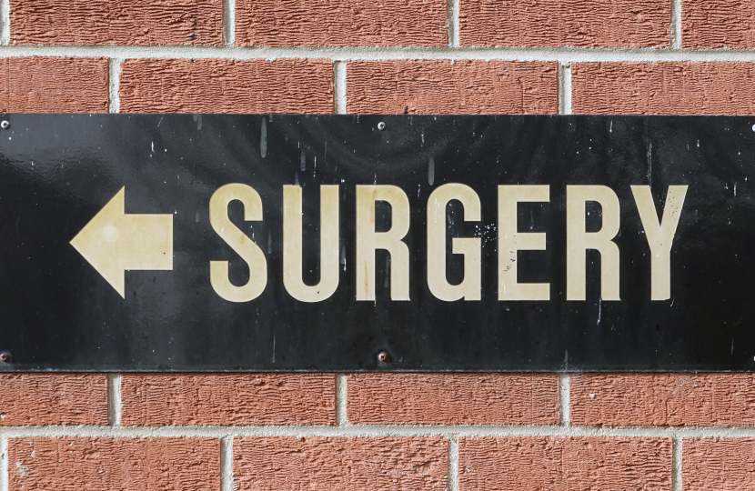 Signpost showing the direction of the nearest GP Surgery